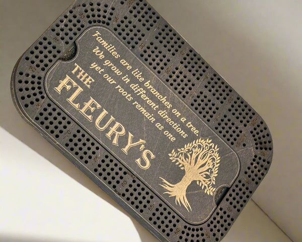 black stained crib board with a tree of life engraving