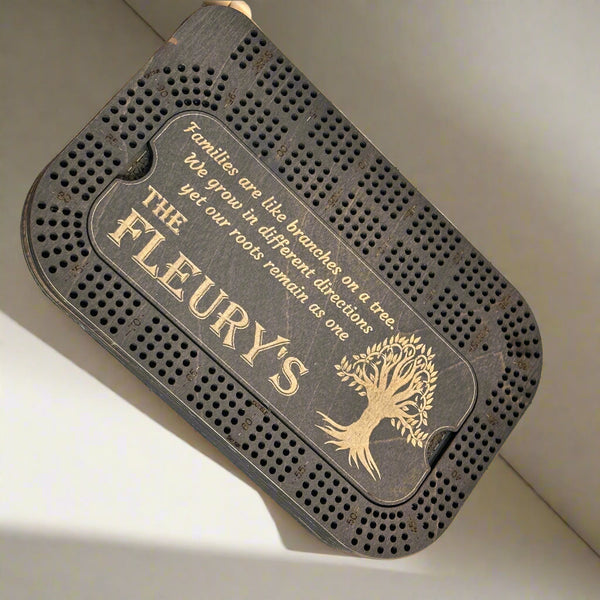 black stained crib board with a tree of life engraving