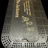 black stainedcribbage board with image of a family engraved