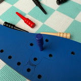 Blue peg boards setup  on a checkered floor