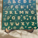 green wood stained letter puzzle