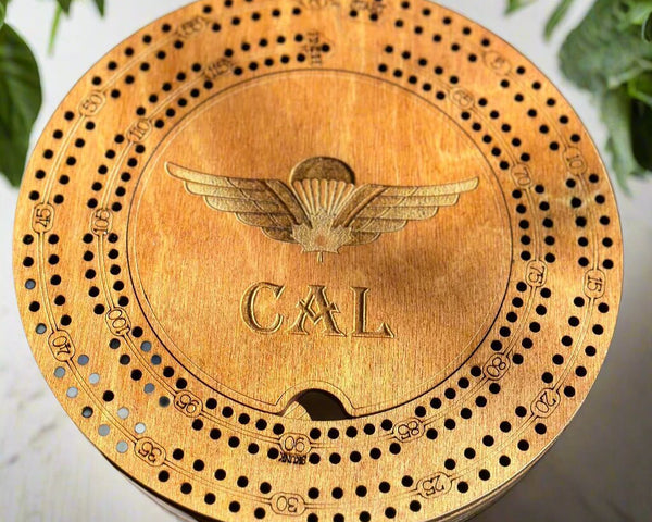 map;e stained wood round crib board size 7.5 in. diameter,for 2 player,comes with pegs and a deck of card,personalized with a name and a air force logo
