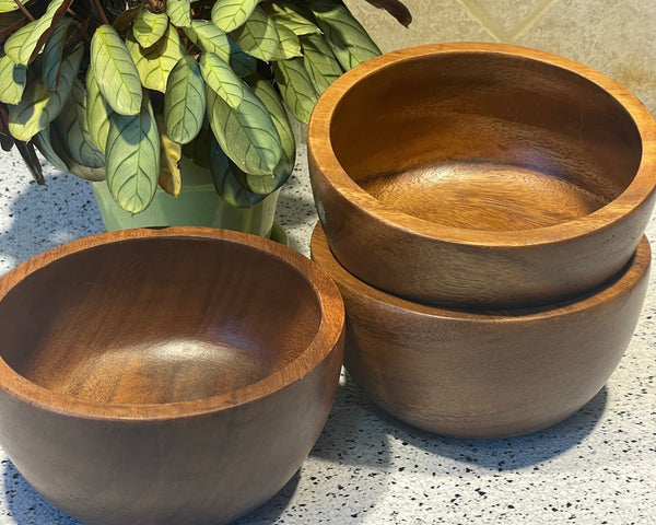 an image of three wooden bowls size 6 in. wide x 3 in.tall approximately