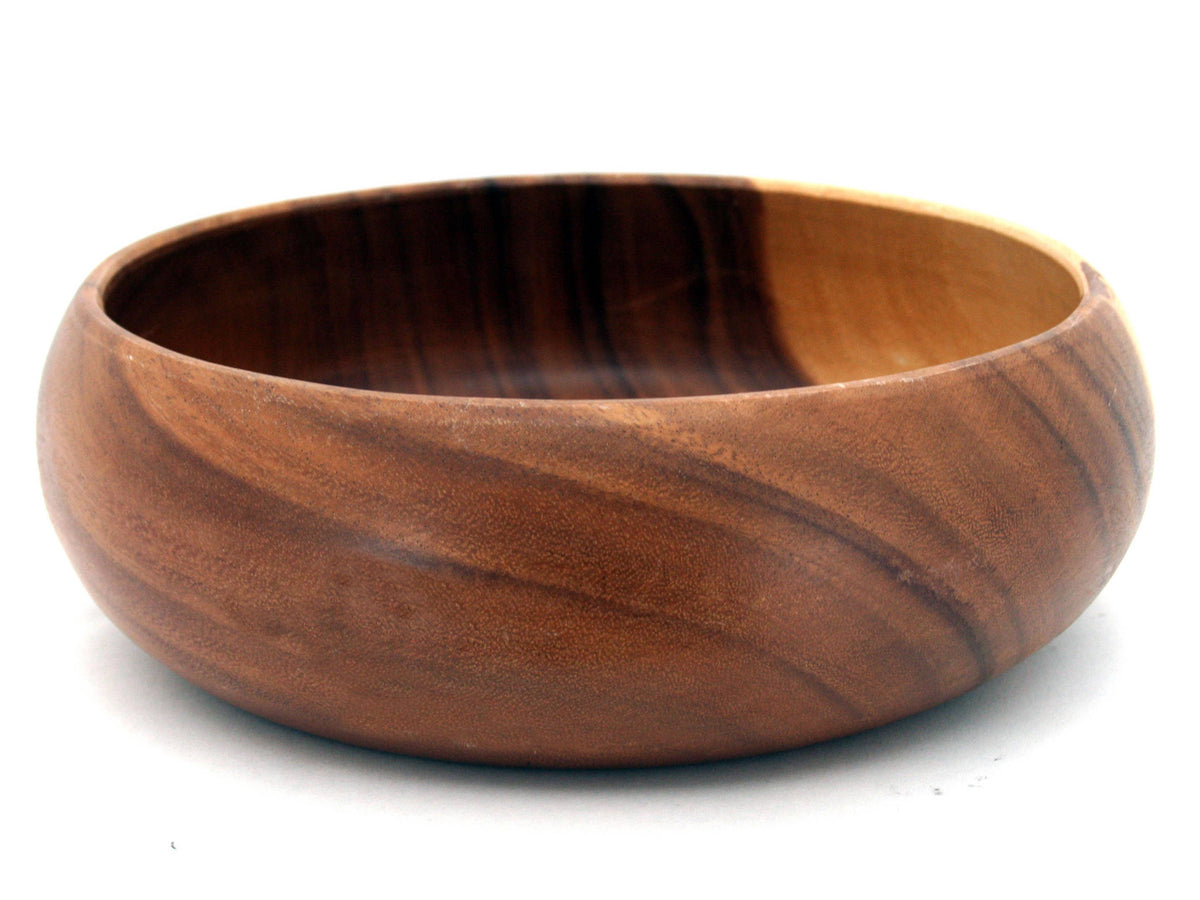 Wooden bowl with a brown and black striped pattern on a white background