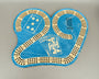 Blue cribbage board with playing card designs on a gray background