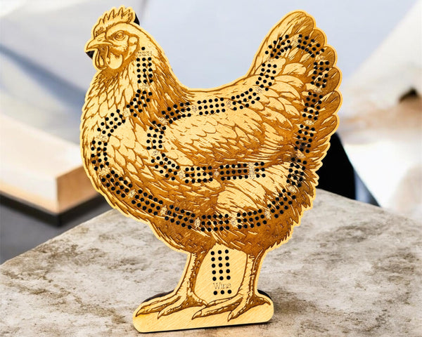 Gold chicken-shaped decorative item on a marble surface