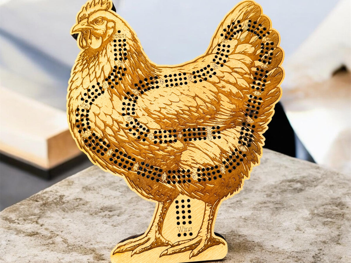 Gold chicken-shaped decorative item on a marble surface