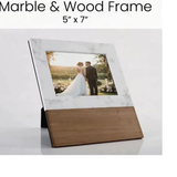 Marble and wood frame with a 5x7 photo of a couple in a garden.