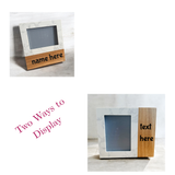 Two wooden picture frames with marble accents, one displaying 'name here' and the other 'text here'.