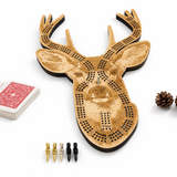 Wooden deer head cribbage board with playing cards and pegs on a white background