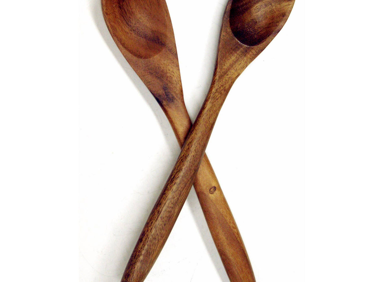 Wooden spoon and fork set on a white background