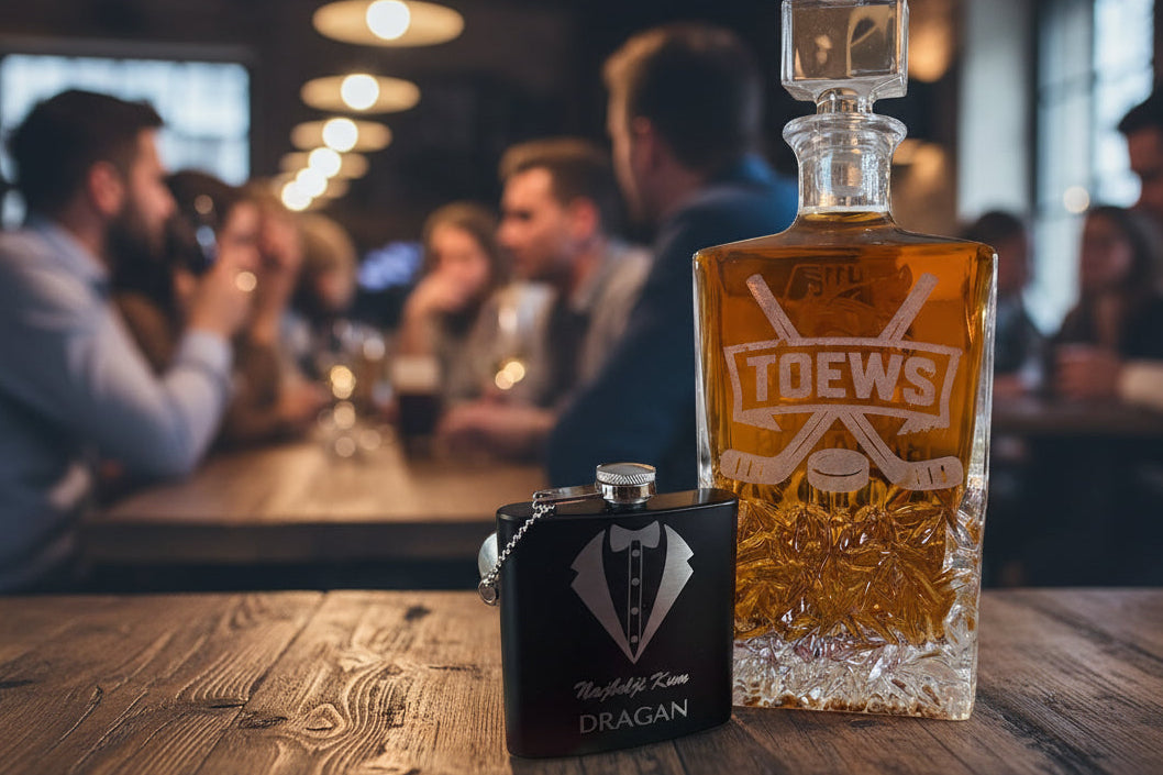 Bottle of amber liquid with 'TOEWS' branding and a black flask on a textured surface.