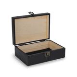 Black wooden jewelry box with beige interior on a white background