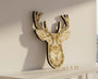 Decorative deer head with antlers on a black background