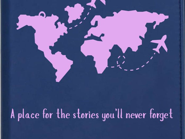 Navy blue planner with pink world map and airplane illustrations on a dark background