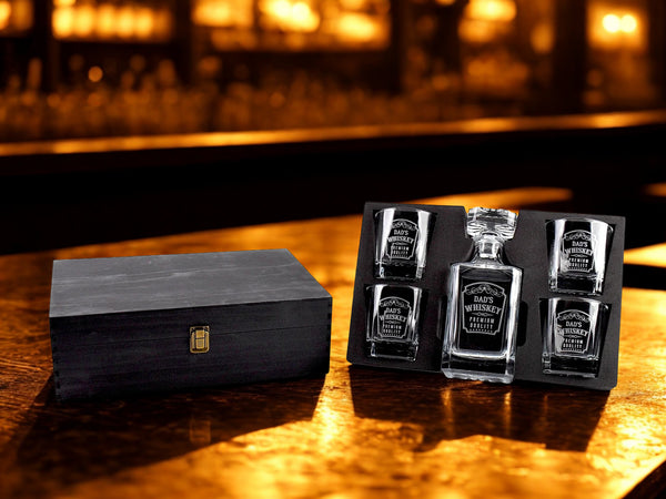 whiskey bottles and packaging on a bar counter with a blurred bar background