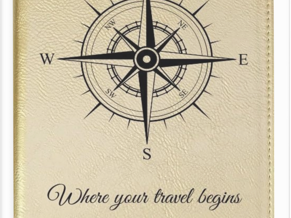 Beige planner with compass design and text 'Where your travel begins' on a beige background