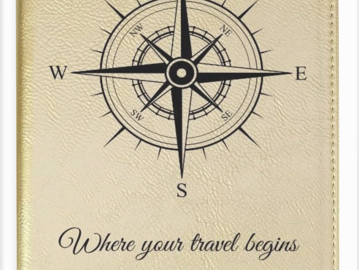 Beige planner with compass design and text 'Where your travel begins' on a beige background