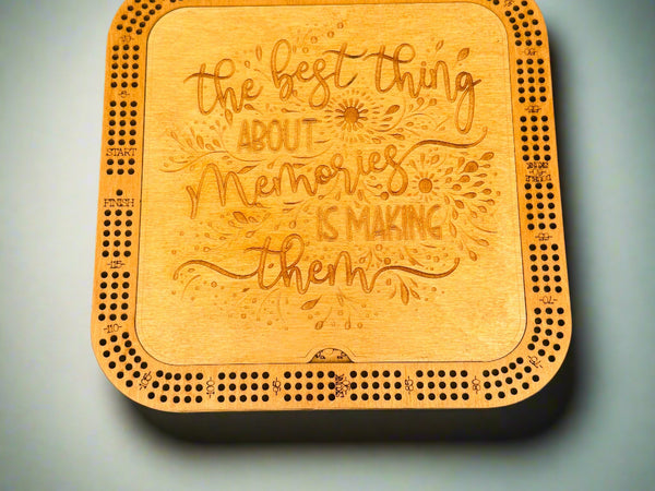 Wooden coaster with engraved text on a gray background