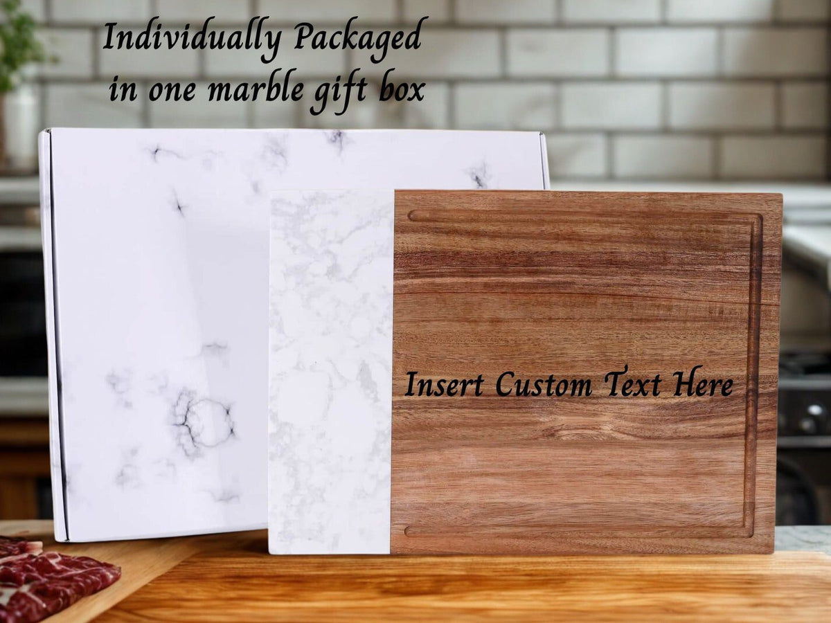 Wooden cutting board with marble gift box on a kitchen counter