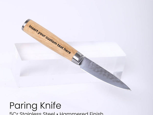 Paring knife with wooden handle on a white background