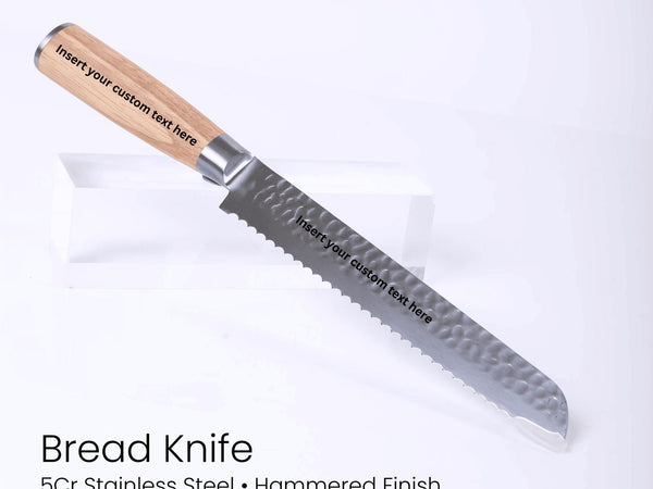 Bread knife with wooden handle on a white background