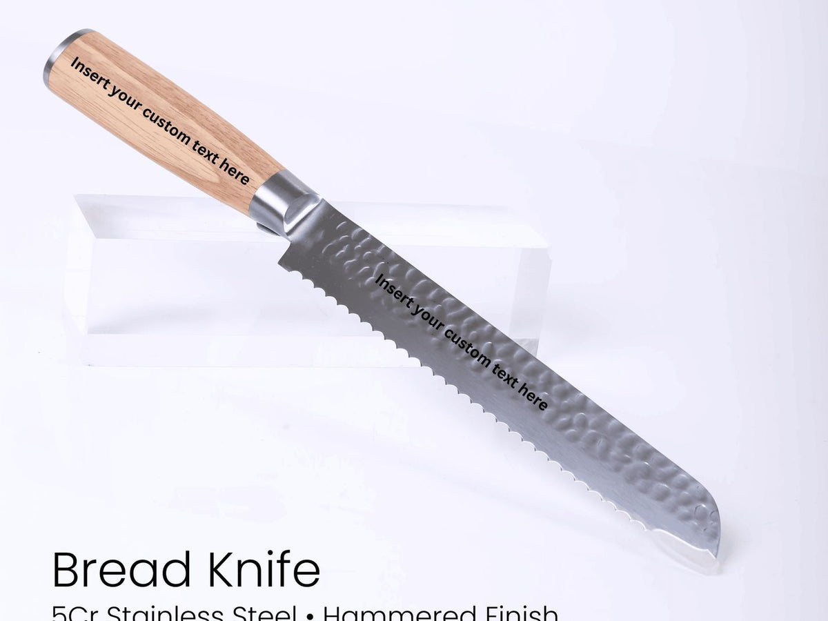Bread knife with wooden handle on a white background