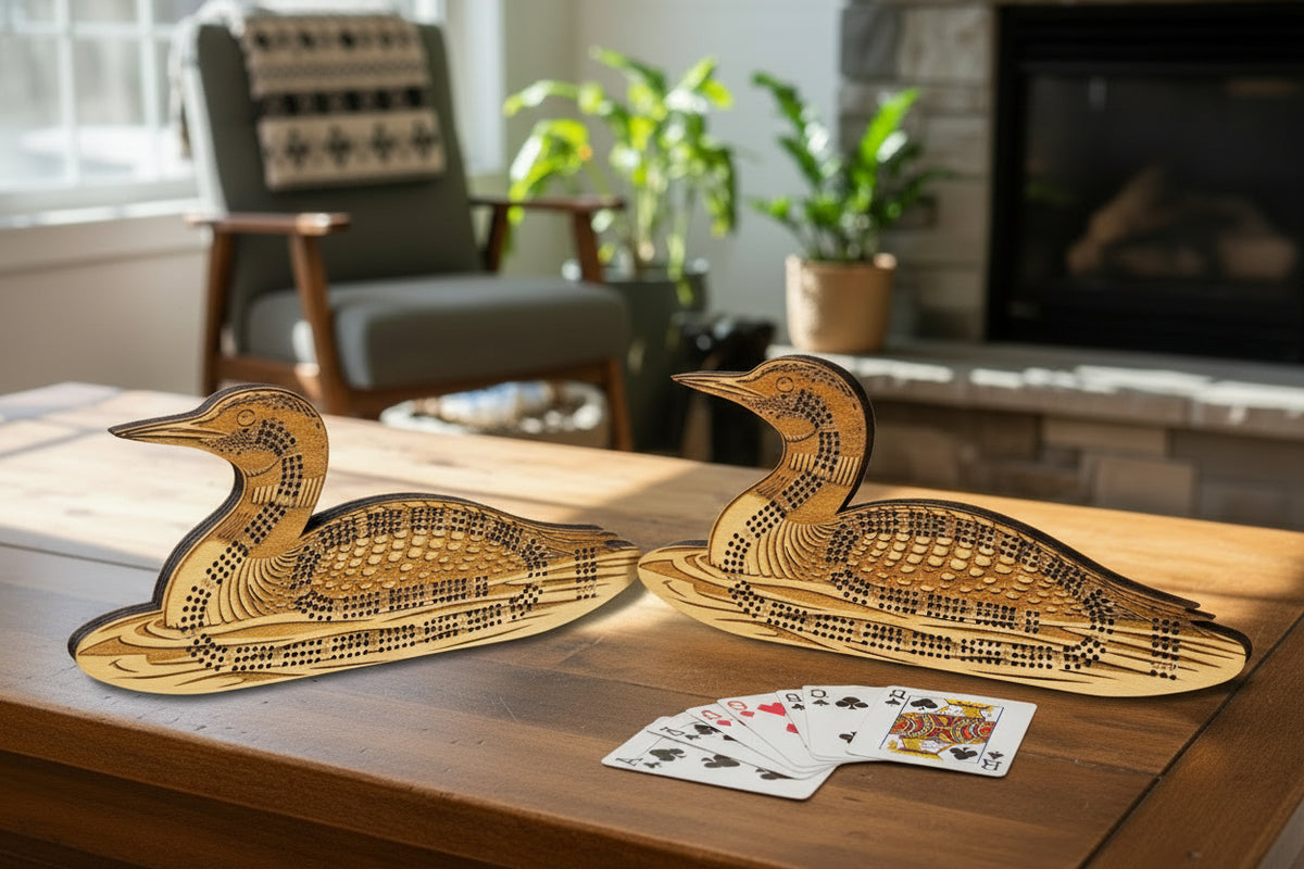 Two wooden duck-shaped carvings on a light stone surface