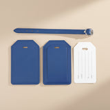 Two blue luggage tags and a belt on a white background