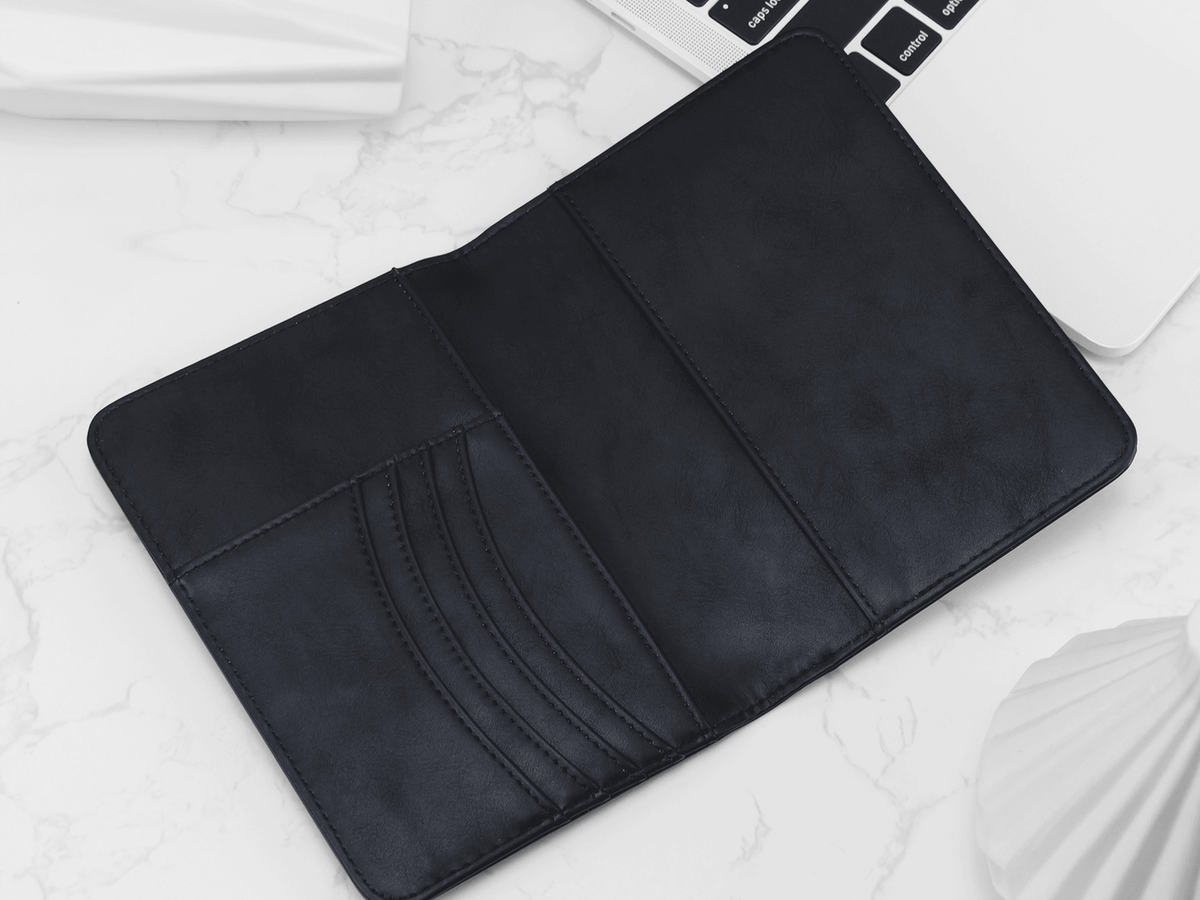 Black leather sleeve on a laptop with a white background