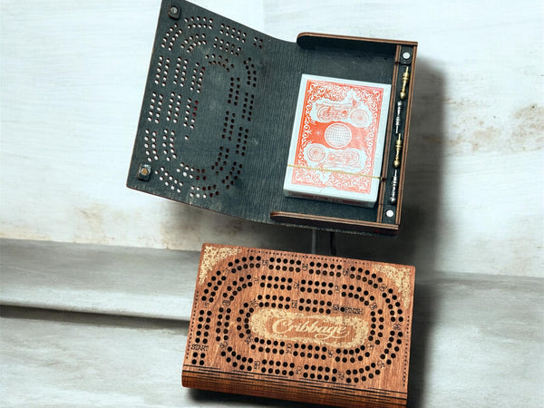 Wooden cribbage board with cards on a light wooden surface