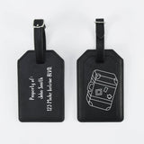 Two black luggage tags with white text and design on a white background