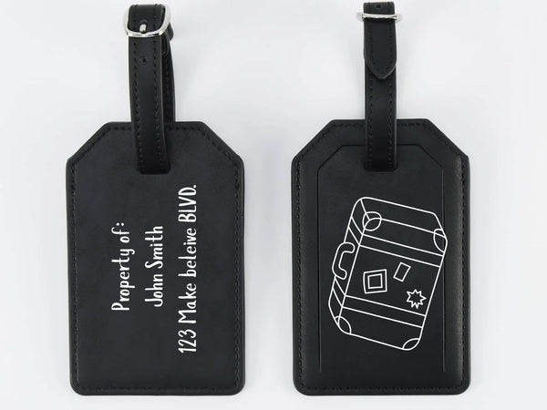 Two black luggage tags with white text and design on a white background