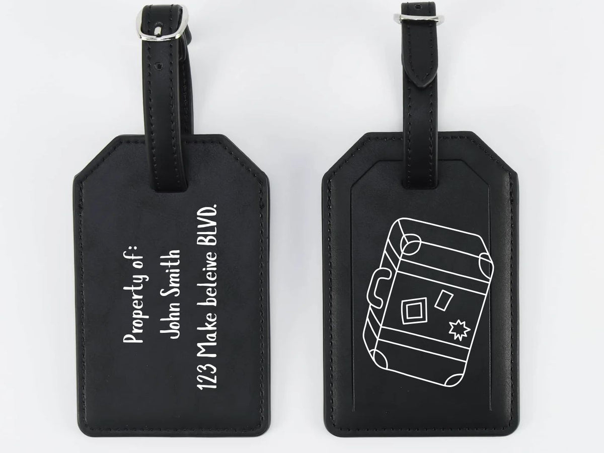Two black luggage tags with white text and design on a white background