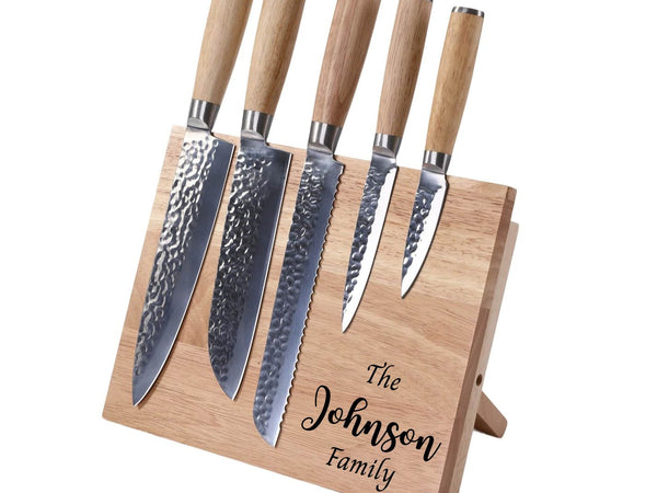 Set of five knives with wooden handles on a wooden stand engraved with 'The Johnson Family' on a white background.