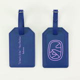 Two blue luggage tags with text and a design on a white background