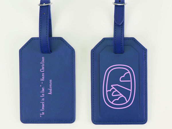 Two blue luggage tags with text and a design on a white background