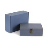 Two blue boxes, one larger and one smaller with a latch, on a white background.