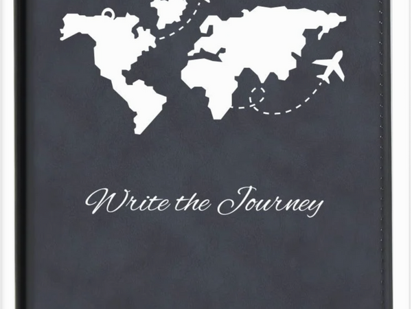 Journal with world map and airplane illustrations on a dark blue cover