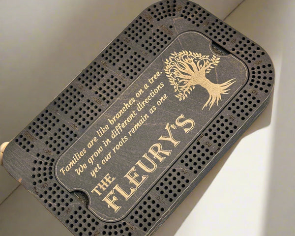 black stained crib board with a tree of life engraving