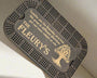 black stained crib board with a tree of life engraving