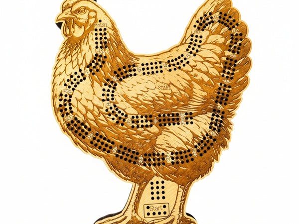 Gold-colored chicken-shaped object with black dot patterns on a white background