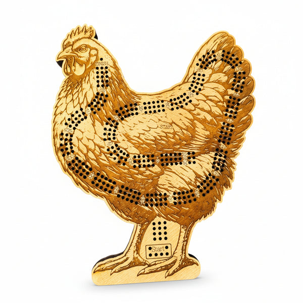 Gold-colored chicken-shaped object with black dot patterns on a white background