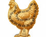 Gold-colored chicken-shaped object with black dot patterns on a white background