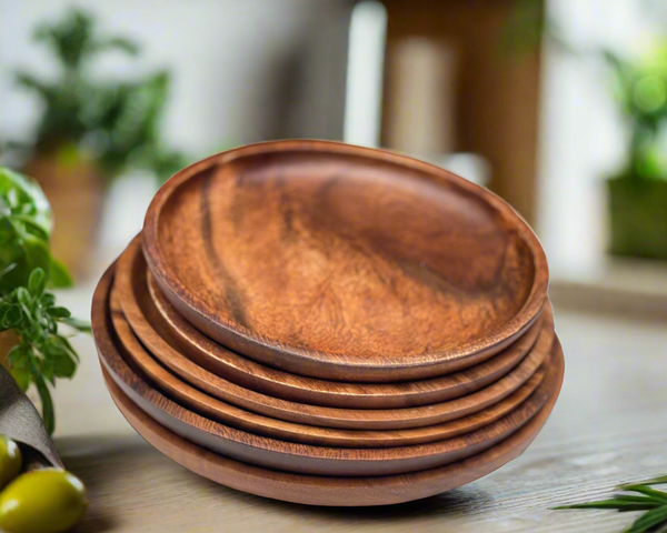 acacia wood round plate on a wood table