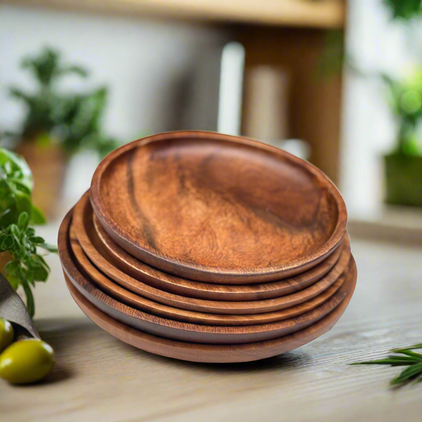 acacia wood round plate on a wood table