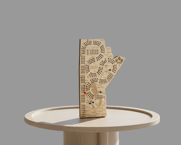 Decorative hand-shaped wooden board with intricate patterns on a dark surface.