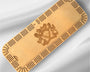 Wooden cribbage board with a crest design on a gray background