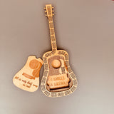 Wooden guitar-shaped cogs with humorous text on a gray background