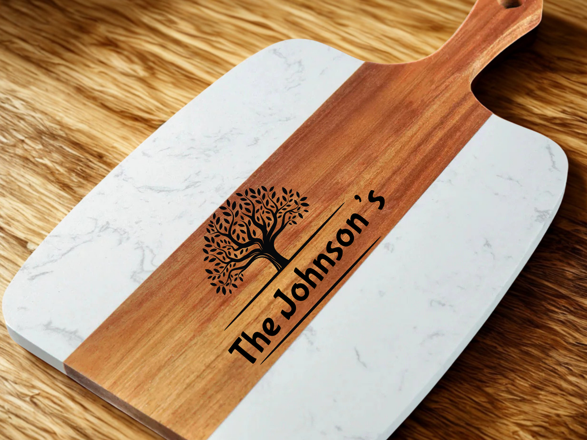 Wooden and marble cutting board with 'The Johnson's' engraving on a wooden surface